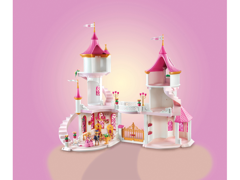 Château de jeu rose avec figurines et accessoires.