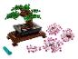 LEGO bonsaï avec des fleurs roses et un outil