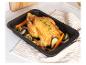 Poulet rôti avec des légumes dans un plat à four noir.