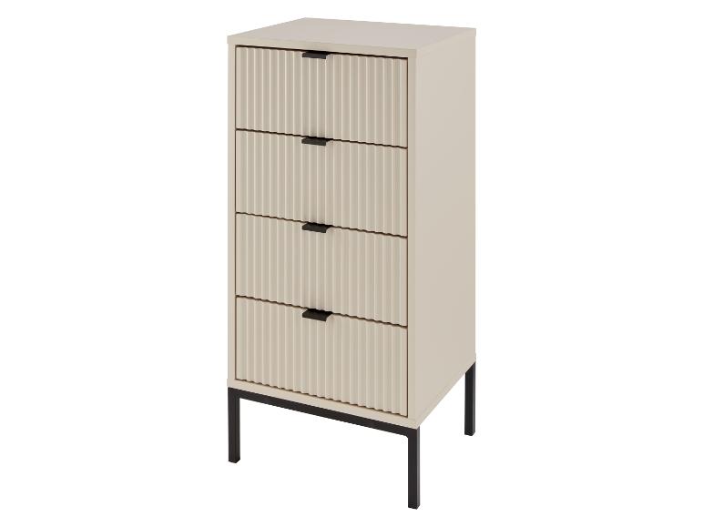 Une commode crème avec quatre tiroirs et des pieds noirs.