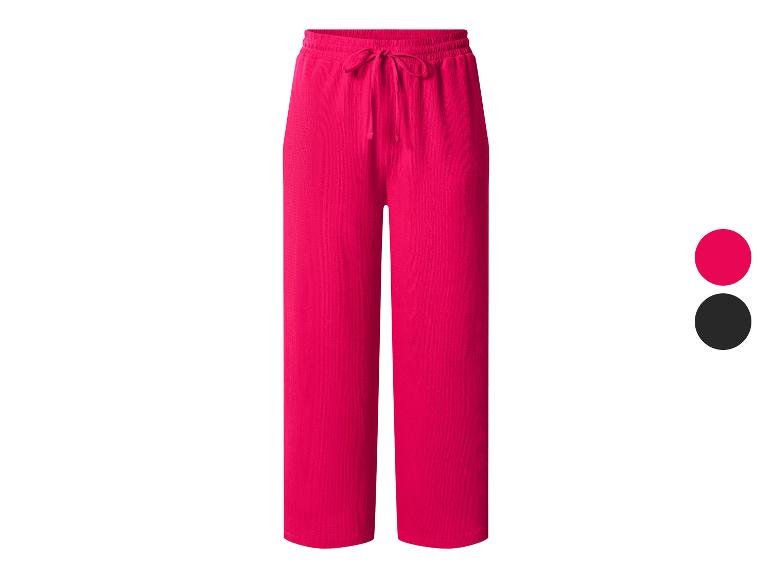 Pantalon large fuchsia avec cordon de serrage à la taille.