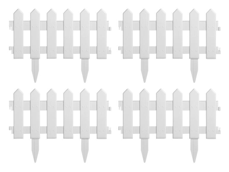 Quatre clôtures de jardin en plastique blanc avec des pointes pointues.