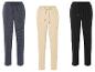 Trois pantalons de jogging : bleu marine, beige et noir.