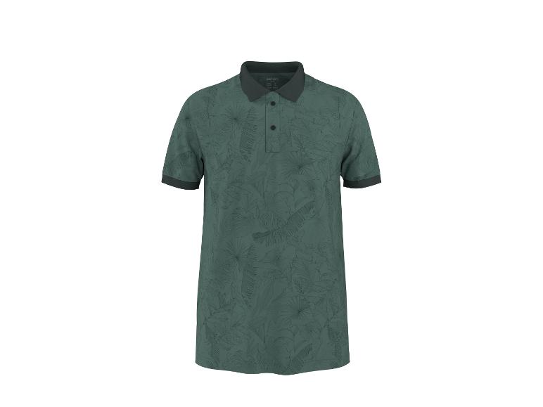 Polo vert avec imprimé feuilles tropicales et col et poignets foncés.