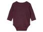 Un body bébé à manches longues de couleur bordeaux.