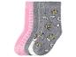 Quatre paires de chaussettes pour enfants, deux roses et deux grises avec des motifs de licorne et de couronne.