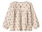 Blouse enfant à manches longues de couleur crème avec imprimé floral.