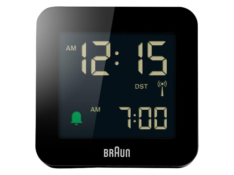 Réveil numérique noir avec écran affichant 12h15 et alarme réglée sur 7h00.