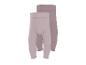 Deux leggings côtelés pour bébé en rose clair et beige.