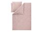 Housse de couette et taies d'oreiller en lin rose clair sur fond blanc.