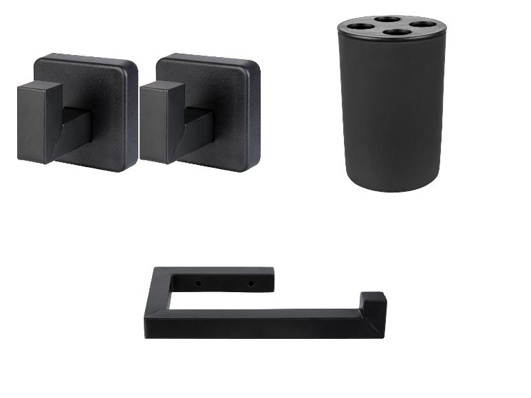 Accessoires de salle de bain noirs : deux crochets, un gobelet et un porte-papier toilette.