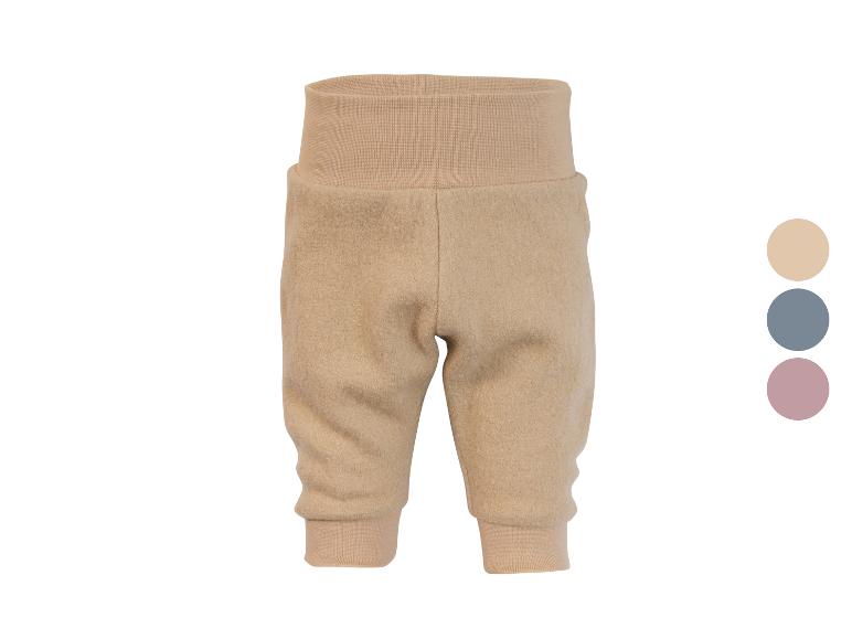 Pantalon bébé beige avec taille et poignets côtelés hauts, avec options de couleur.