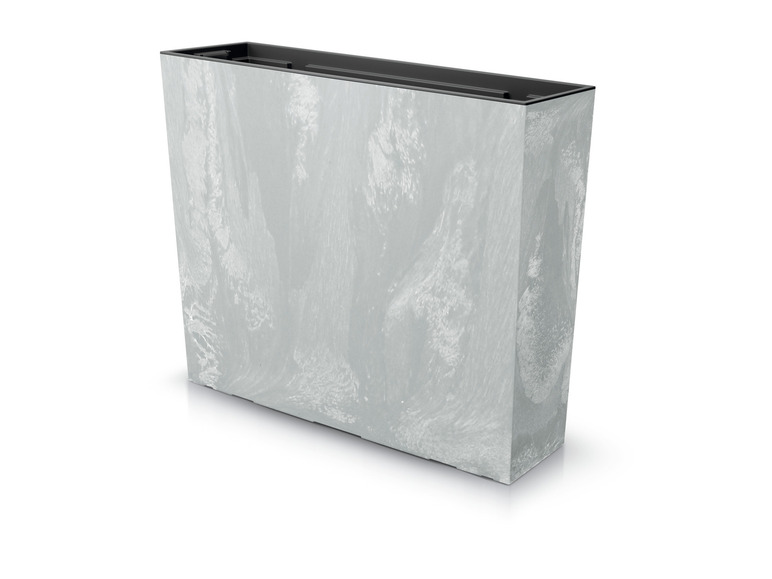 Un pot de fleurs en béton gris pour l'intérieur ou l'extérieur.