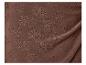 Tissu marron à motifs floraux ajourés.