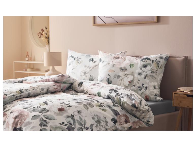Drap-housse en jersey LIVARNO home sur un lit avec parure de lit florale