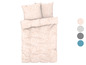 Une housse de couette et des taies d'oreiller avec un motif rose de points en cercles.