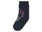 Une chaussette bleu foncé avec une licorne rose et des cœurs.