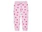 Pantalon de jogging rose à motif cœurs pour enfant.