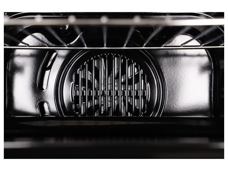 Intérieur du four avec ventilateur à convection visible et grille.