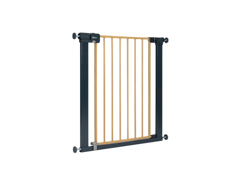 Barrière de sécurité pour enfants avec barreaux en bois et cadre métallique.