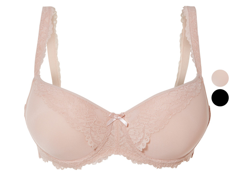 Un soutien-gorge beige en dentelle avec un nœud.