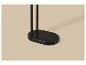Base ovale noire d'un porte-manteau ou d'un support sur un fond beige.