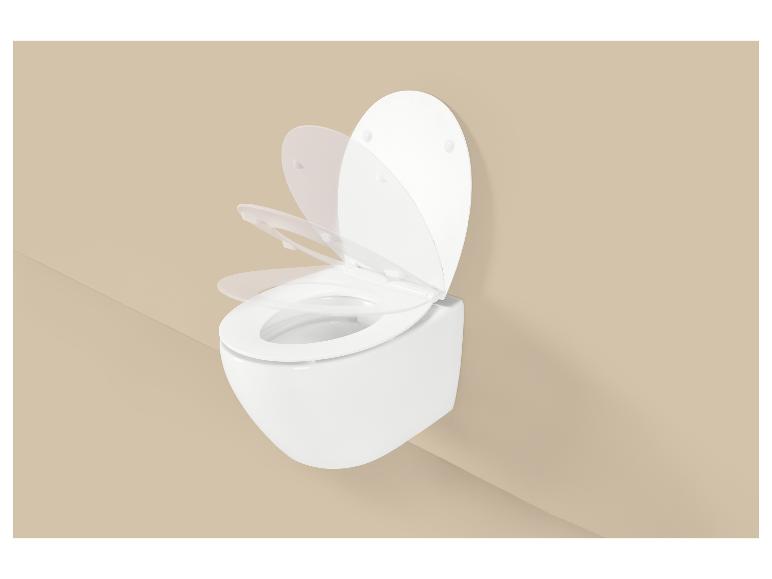 Abattant de toilettes à fermeture douce en mouvement sur fond beige