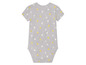 Un body bébé gris à pois jaunes et blancs.