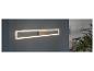 Un luminaire LED long et fin monté sur un mur