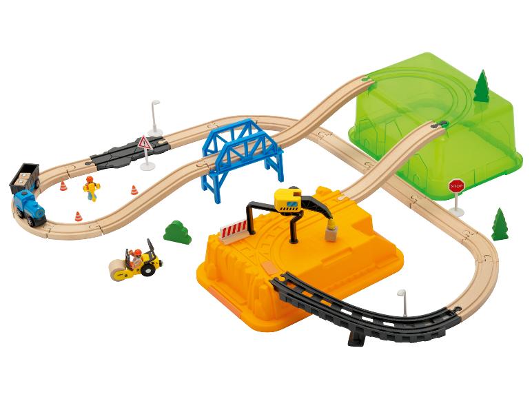 Ensemble de train en bois avec train, pont, tunnel et véhicules de construction.
