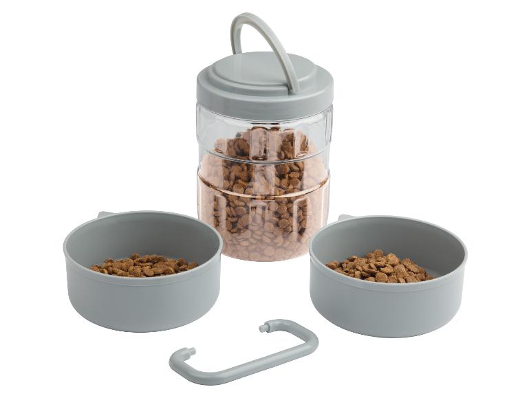 Distributeur de nourriture pour animaux avec deux bols et une grande réserve.