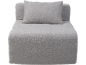 Canapé modulaire gris avec coussin, en tissu texturé.