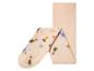 Collants bébé beiges avec des points antidérapants et un motif animal.