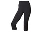 Leggings capri noires avec des détails réfléchissants de la marque Under Armour.