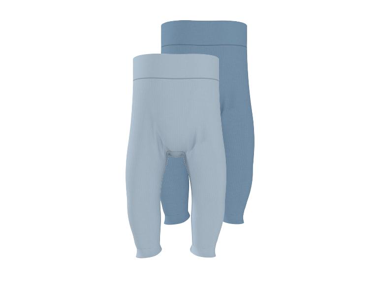 Deux pantalons côtelés pour bébé en bleu clair et bleu foncé