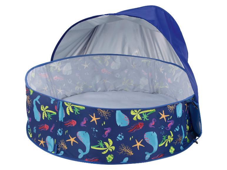 Piscine bébé bleue avec motif marin et pare-soleil.