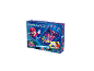 Un jeu de flipper Super Mario Galaxy avec Mario sur la boîte, avec avertissement pour petites pièces.