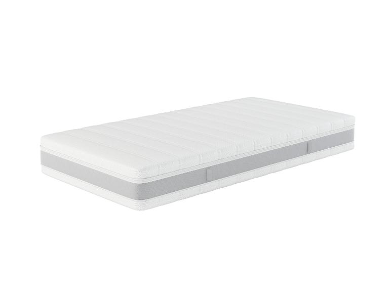 Matelas blanc avec côtés gris et coutures horizontales.