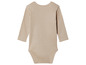 Un body bébé beige à manches longues.