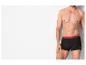 Homme en boxers noirs avec une ceinture rouge portant l'inscription 'GRAND POLO US'.