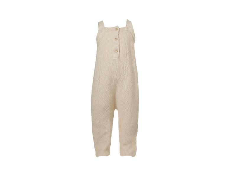 Barboteuse bébé tricotée beige avec bretelles et boutons.