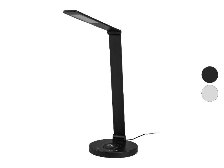 Lampe de bureau LED noire avec chargeur sans fil et deux échantillons de couleur.