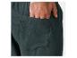 Pantalon foncé avec poche, tissu uni.