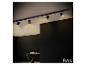 Luminaire sur rail noir moderne BRILONER avec quatre spots orientables au plafond.
