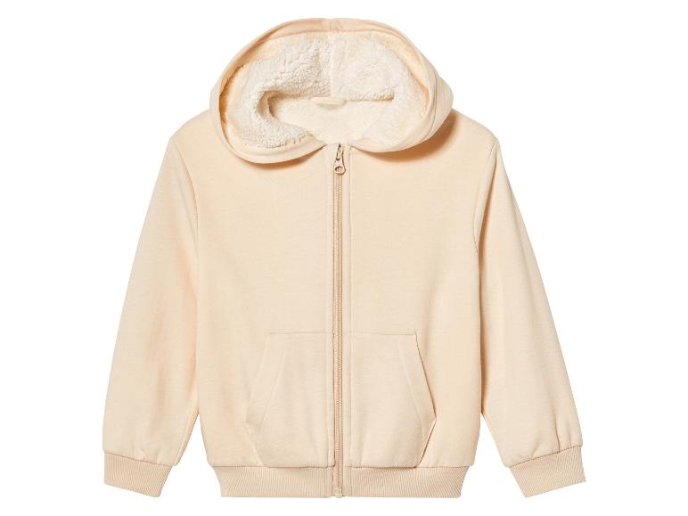 Sweat-shirt à capuche beige avec fermeture éclair et doublure polaire.