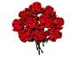 Un bouquet de roses rouges en briques de construction avec des tiges vertes sur fond blanc.