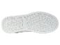 Semelle blanche de chaussure de sport avec le logo U.S. Grand Polo.
