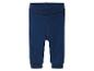 Pantalon bébé bleu foncé avec une large ceinture repliée et des poignets côtelés.
