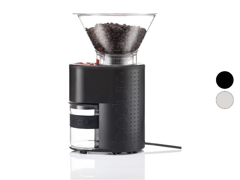 Un moulin à café Bodum noir avec une trémie transparente remplie de grains de café.