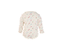 Body bébé à manches longues avec imprimé floral sur fond crème.